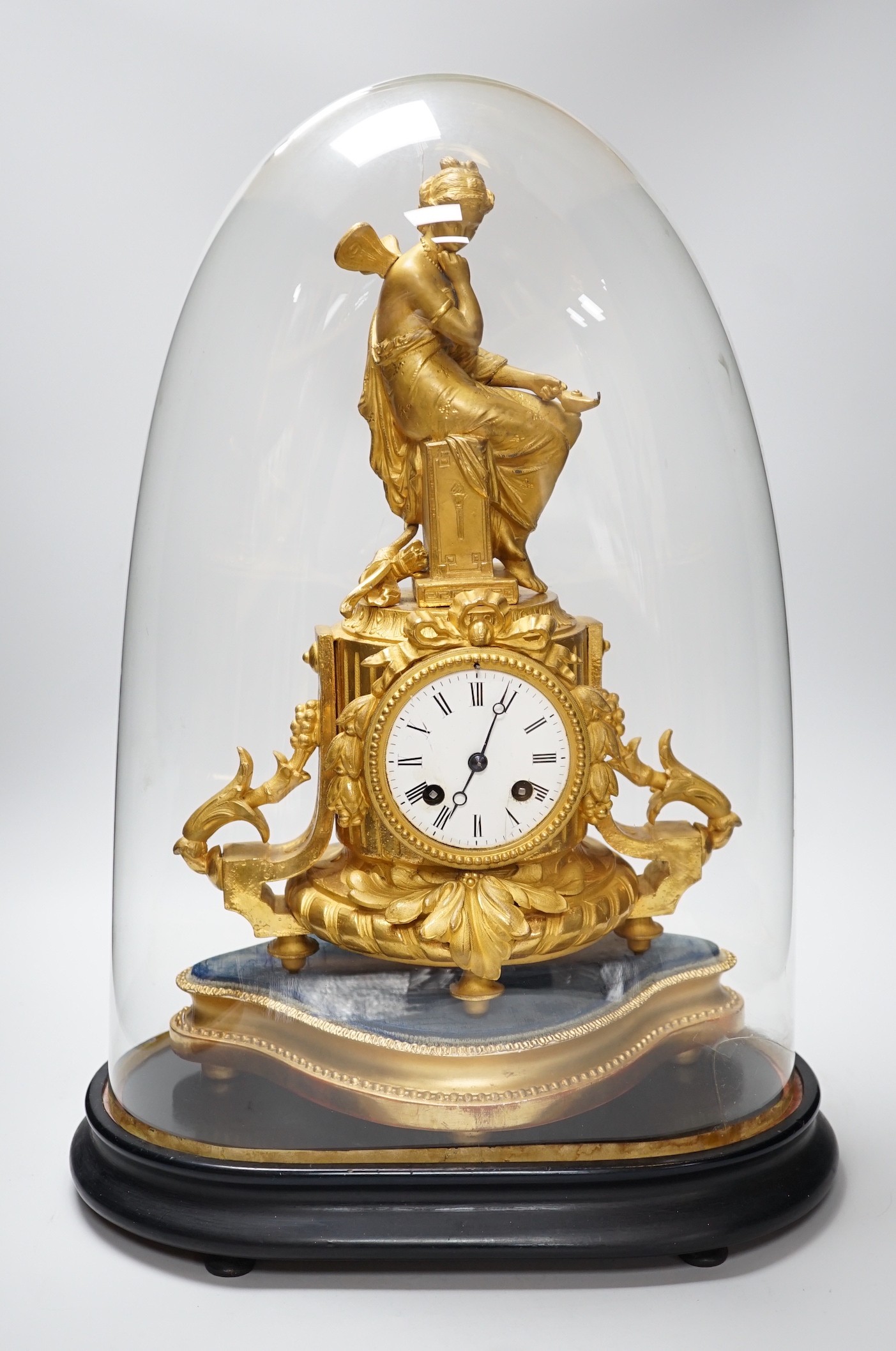 A French 19th century gilt metal clock by Phillipe H. Mourey on stand with glass dome, total height 49cm (dome a.f.)
